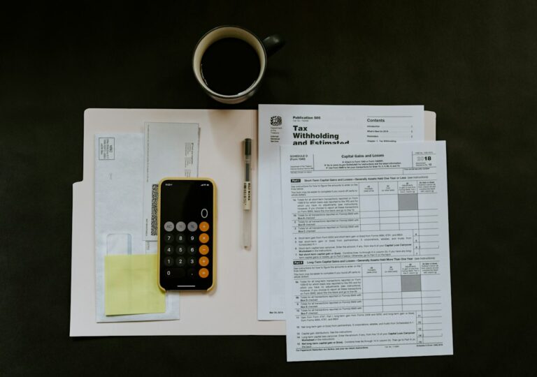 Corporate tax forms and financial documents on a desk